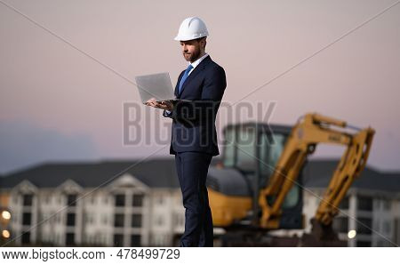 Construction Business Owner. Man In Suit And Hardhat Halmet At Building Construction Site. Civil Eng
