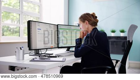 Accountant Using E Invoice Software At Computer In Office