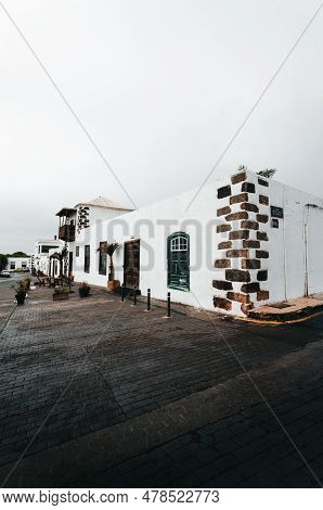 Photo Of Traditional House In Lanzarote - Canary Islands. Vertial Photo Of Cozy White Building In Te
