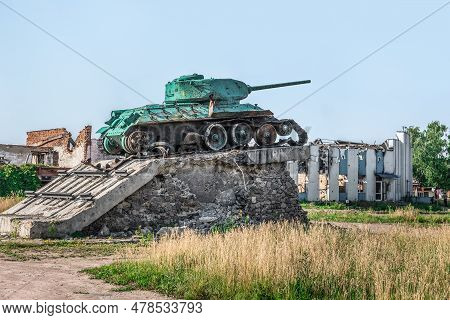 Trostyanets, Sumy Oblast, Ukraine - June 18, 2023: Damaged Tank Monument On The Background Of The De