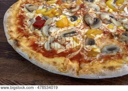 Funghi Pizza With Tomato Sauce, Cheese, Mushrooms, Peppers And Corn On Wooden Table