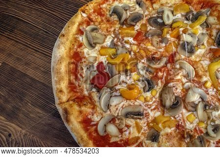 Funghi Pizza With Tomato Sauce, Cheese, Mushrooms, Peppers And Corn On Wooden Table