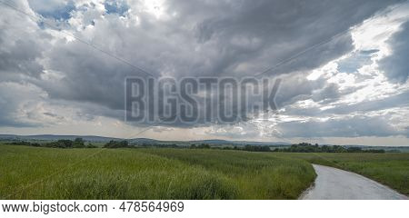 Swietokrzyskie Landscapes. Cloudy Sky . View Of The Holy Cross Mountains. Isible Fields With Green C