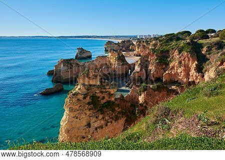 Spectacular View Of Alvor Village And Colorful Limestone Rocks. Trekking Route From Portimao To Alvo
