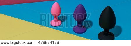 Different Colored Buttplug Sex Toys With Contrast Shadows. Anal Toys For Adult. Sex Shop Concept
