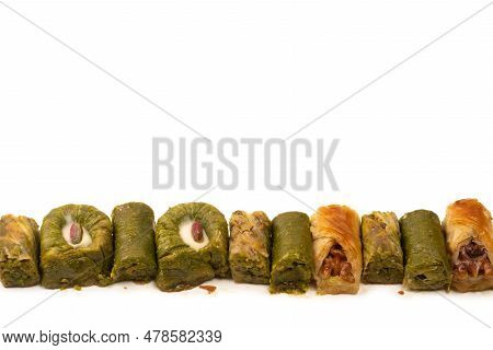 Turkish Pistachio Baklava Isolated On A White Background. A Variety Of Turkish Sweet Baklava. Walnut