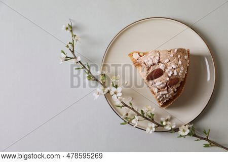 Plate With Piece Of Delicious Italian Easter Dove Cake (traditional Colomba Di Pasqua) And Flowering