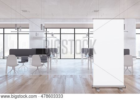 Modern Concrete And Wooden Coworking Office Room Interior With Blank White Mock Up Roll-up Frame, Pa