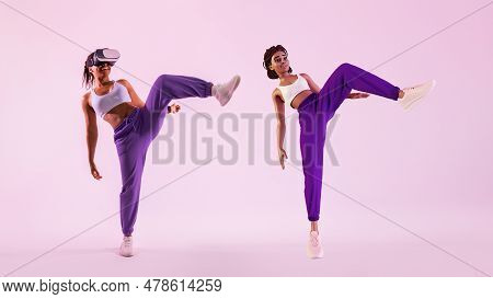 Fitness In Digital Age. Black Woman Exercising In Metaverse As Avatar Wearing Virtual Reality Headse