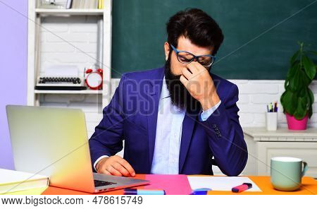 Education. Stressed Tired Student Preparing To Test Or Exam In Classroom. Fatigue After Long Laptop 