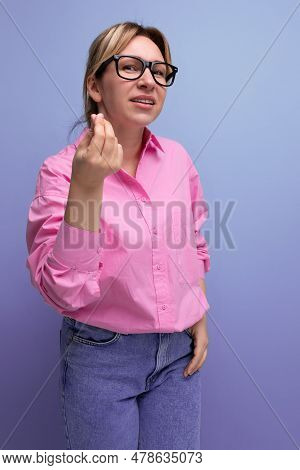 Young Stylish Blond Caucasian Secretary Woman With Glasses Is Dressed In A Pink Blouse