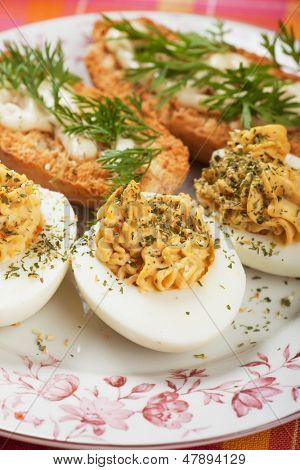 Deviled eggs with bread and mayonnaise, rich and tasty breakfast plate
