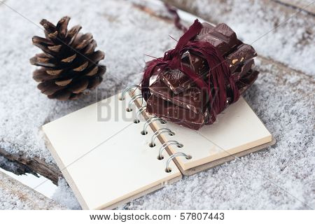Chocolate On The Notebook And Strobile