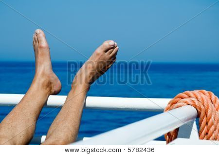 Feet on the Railing