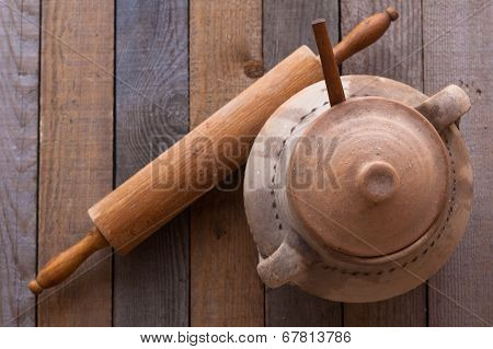 Old Crock With Rolling Pin