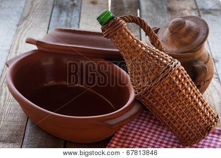 Old Crocks With Rattan Bottle