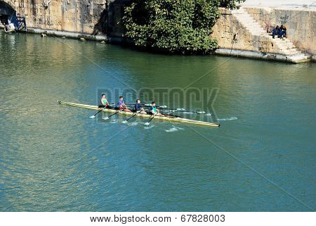 Rowers on river, Seville, Spain.