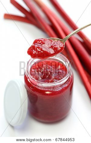 homemade rhubarb jam in jar isolated on white background