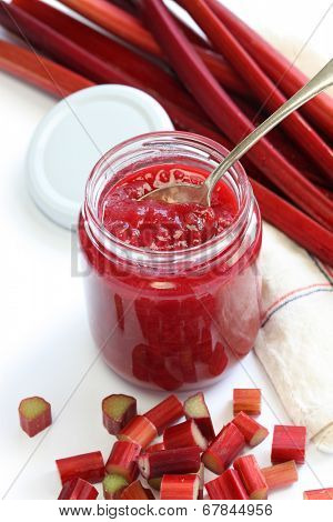 homemade rhubarb jam in jar isolated on white background