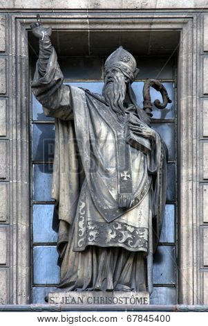 PARIS,FRANCE - NOV 09,2012:Saint Matthew the Evangelist, architectural details of Eglise de la Madeleine. Madeleine Church was designed in its present form as a temple to the glory of Napoleon's army.