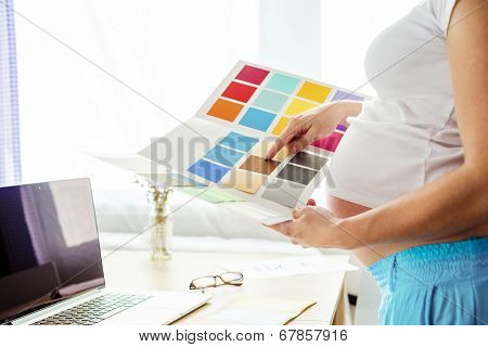 Pregnant woman working from home