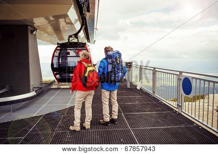 Senior hikers waiting for cableway