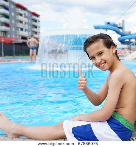 Happy little boys enjoying relaxing and splashing in water
