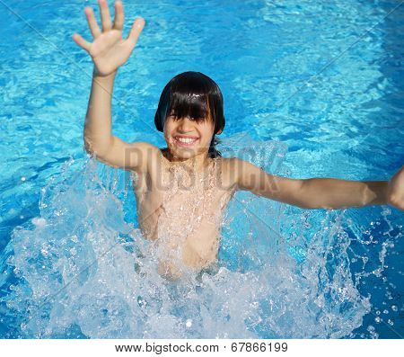 Happy little boys enjoying relaxing and splashing in water