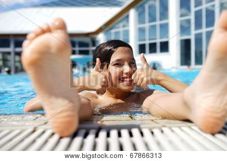 Happy little boys enjoying relaxing and splashing in water