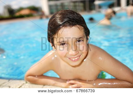 Happy little boys enjoying relaxing and splashing in water