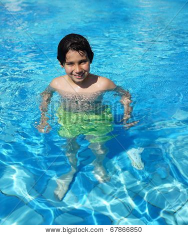 Happy little boys enjoying relaxing and splashing in water