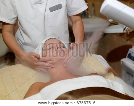 Beautiful Woman Receiving Facial Treatment At A Spa
