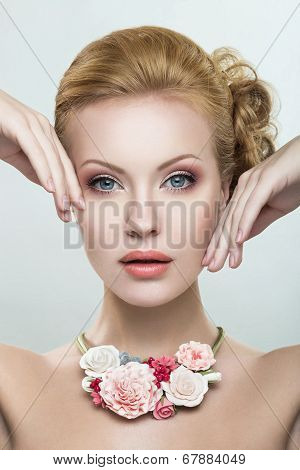 A beautiful woman with a necklace of flowers