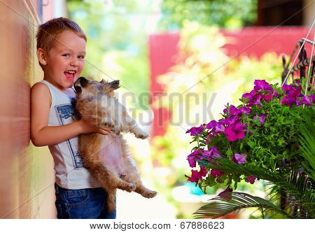 Excited Boy Holding Beloved Puppy