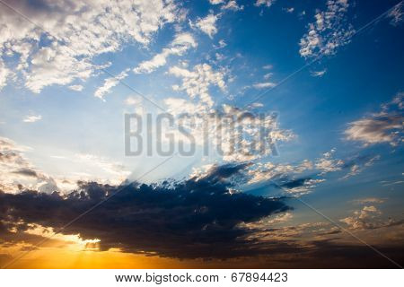 Cloudscape With The Sun Rays Radiating From Behind The Cloud
