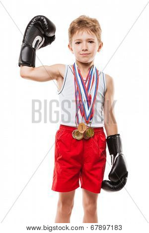 Martial art sport success and win concept - smiling boxing champion child boy holding first place victory gold medal award