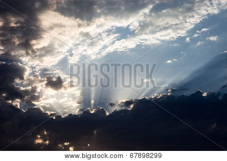 Cloudscape With The Sun Rays Radiating From Behind The Cloud