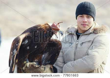 Nura, Kazakhstan - February 23: Eagle On Man's Hand In Nura Near Almaty On February 23, 2013 In Nura