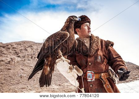 Nura, Kazakhstan - February 23: Eagle On Man's Hand In Nura Near Almaty On February 23, 2013 In Nura