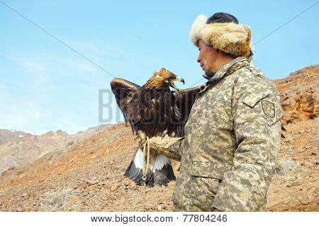 Nura, Kazakhstan - February 23: Eagle On Man's Hand In Nura Near Almaty On February 23, 2013 In Nura