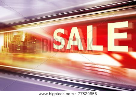 Shop Window With Sale Sign at night