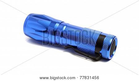 Blue Compact Flashlight On A White Background
