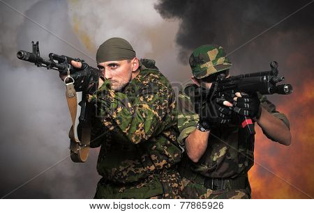 Portrait of soldiers with an automatic assault rifles