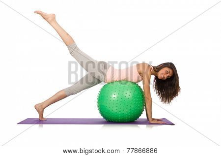 Young woman exercising with swiss ball