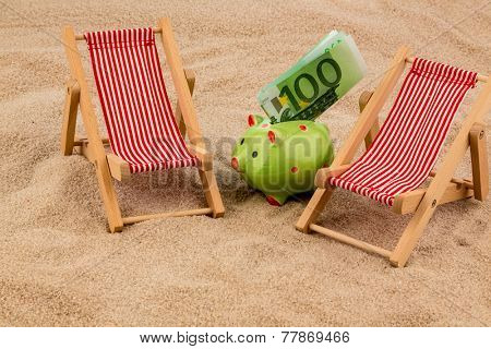 beach chair with euro currency on the sandy beach. symbolic photo for cost of travel, vacation, holidays