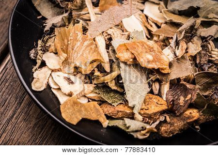 Chinese Traditional Herbs In The Black Plate.