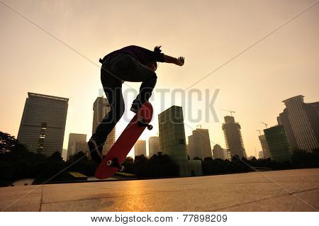 skateboarder skateboarding at sunrise city