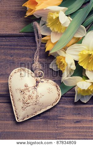 Background With Fresh Daffodils And Tulips And Decorative Heart