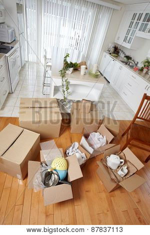 Moving boxes in new house. New apartment background.
