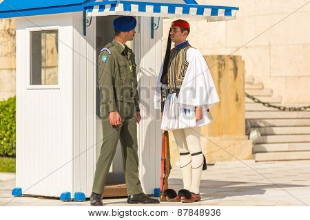 ATHENS, GREECE - APR 13, 2015: Greek soldiers Evzones (or Evzoni) dressed in full dress uniform, refers to the members of the Presidential Guard, an elite ceremonial unit, active from 1833 - present.
